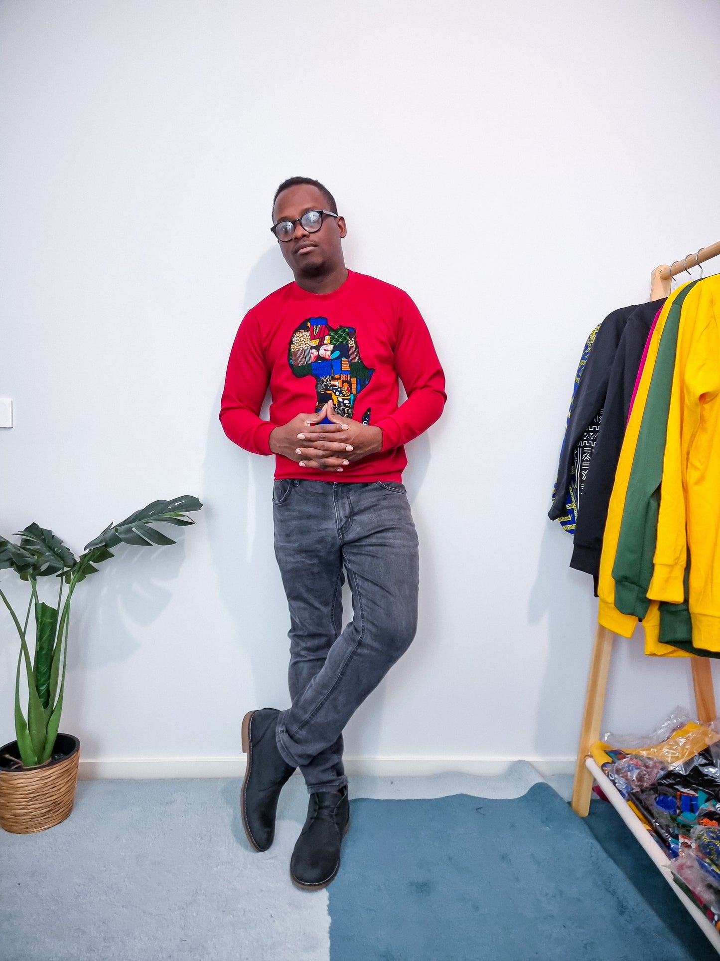 RED JUMPER WITH AFRICAN MAP EMBROIDERY