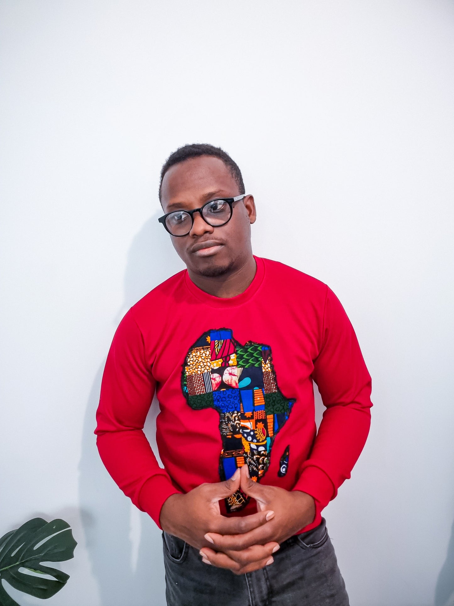 RED JUMPER WITH AFRICAN MAP EMBROIDERY